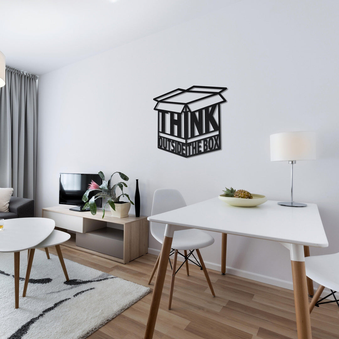 Siyah Think Outside the Box metal duvar dekoru, beyaz yemek masalı salonda duvarda